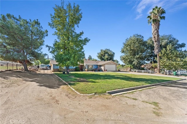 view of front of home featuring a garage and a front lawn