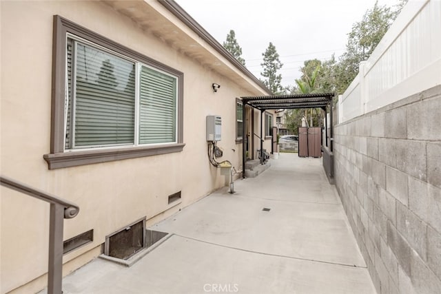 view of home's exterior featuring a pergola and a patio