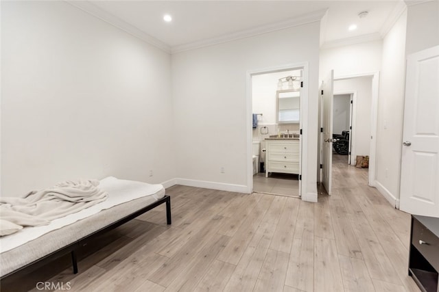 living area with crown molding and light wood-type flooring