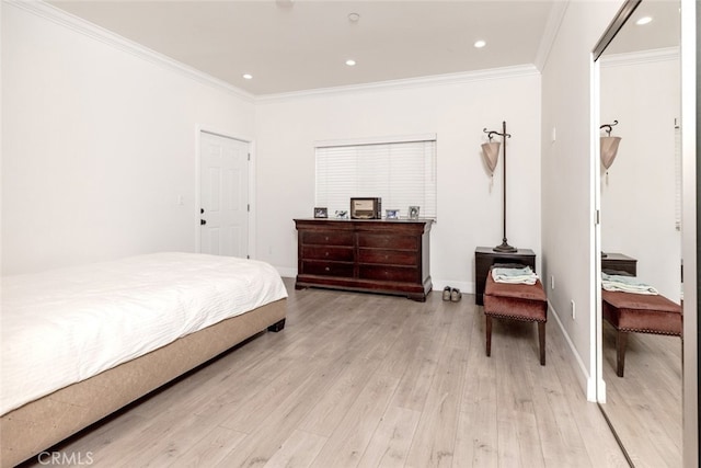 bedroom featuring light hardwood / wood-style floors and crown molding