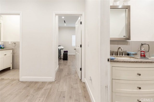 bathroom featuring vanity and wood-type flooring