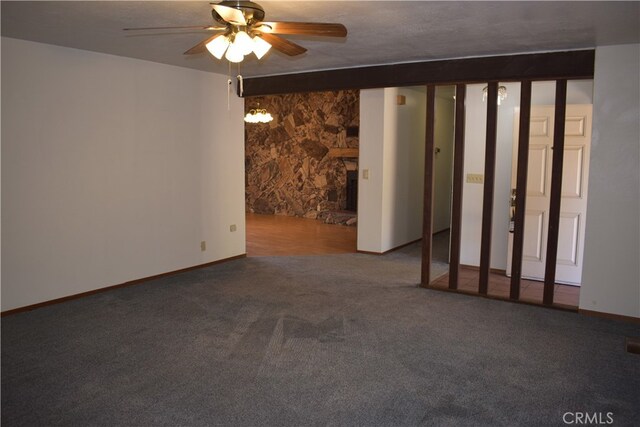 unfurnished room featuring carpet, a textured ceiling, and ceiling fan