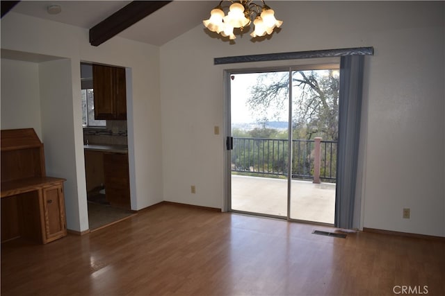 unfurnished dining area with vaulted ceiling with beams, an inviting chandelier, and hardwood / wood-style flooring