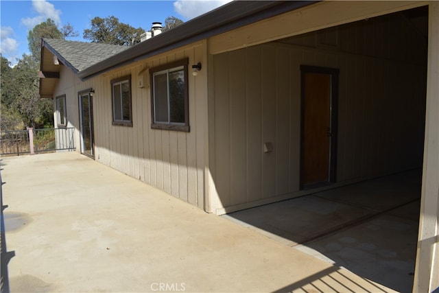 view of side of property with a patio