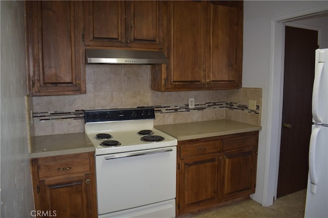 kitchen featuring white appliances and decorative backsplash