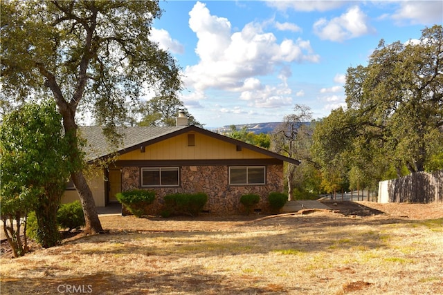 view of side of property with a mountain view