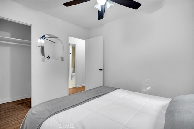 bedroom featuring a closet, wood-type flooring, and ceiling fan