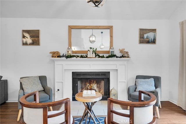 sitting room with hardwood / wood-style flooring