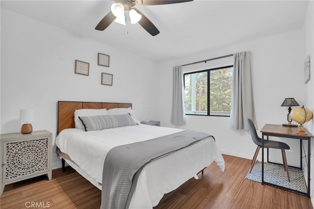 bedroom featuring hardwood / wood-style floors and ceiling fan