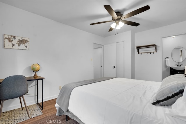 bedroom with ceiling fan and hardwood / wood-style floors