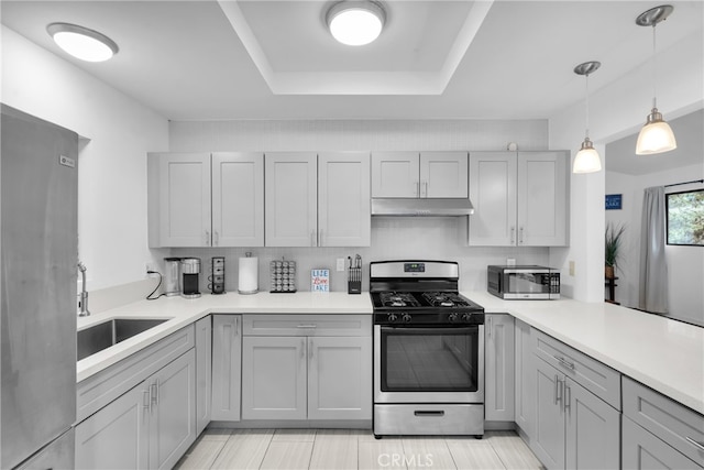 kitchen featuring appliances with stainless steel finishes, sink, and gray cabinetry