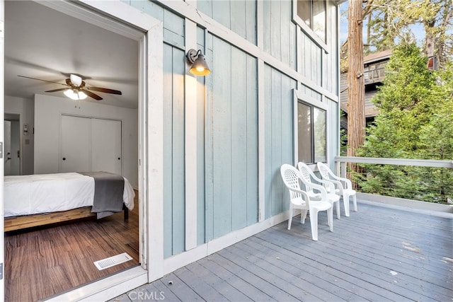 wooden terrace with ceiling fan