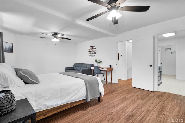 bedroom featuring light wood-type flooring and ceiling fan