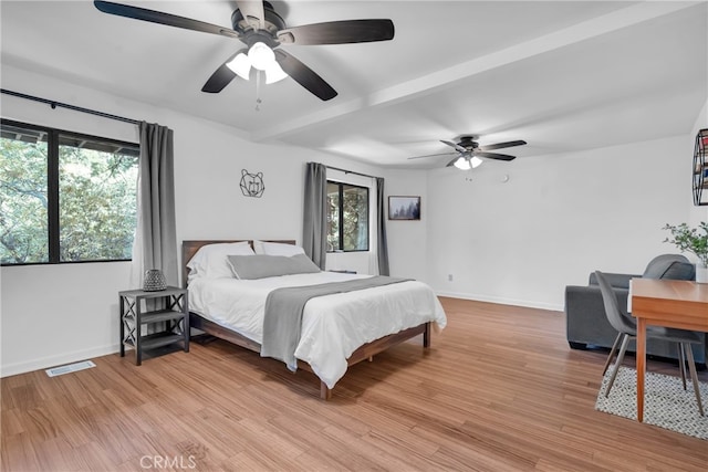 bedroom with light hardwood / wood-style flooring and ceiling fan