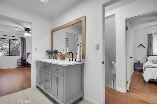 bathroom featuring vanity, hardwood / wood-style flooring, and ceiling fan