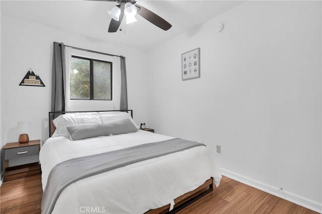 bedroom featuring hardwood / wood-style flooring and ceiling fan