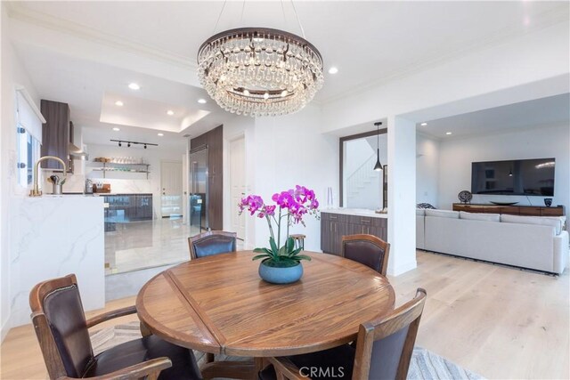 6218 Tobruk Ct, Long Beach, CA 90803 - dining room with a chandelier, ornamental molding, light wood finished floors, and recessed lighting