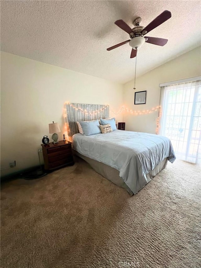 bedroom with carpet, ceiling fan, a textured ceiling, and vaulted ceiling