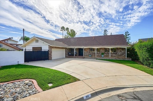 single story home featuring a front lawn and a garage