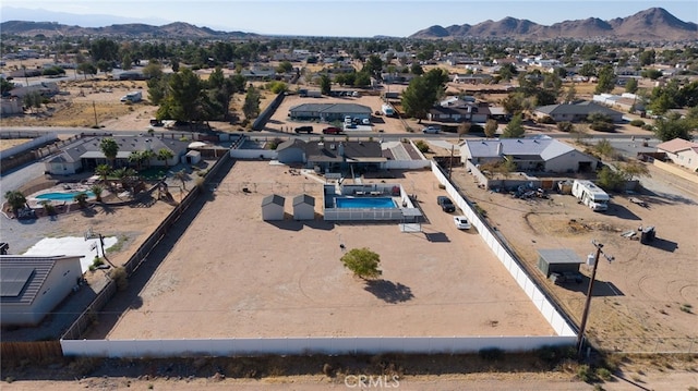 birds eye view of property featuring a mountain view