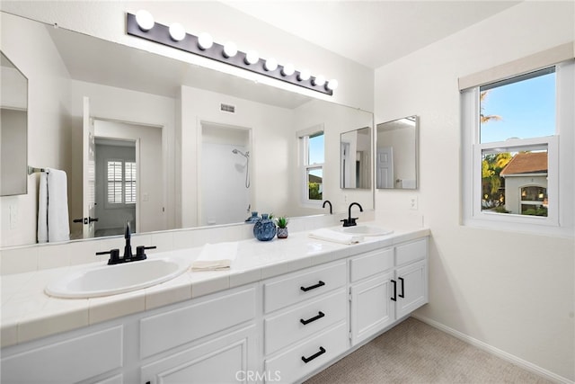 bathroom featuring vanity and plenty of natural light