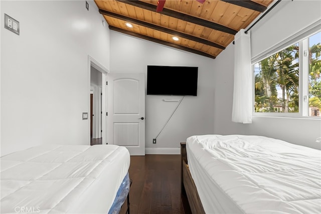 bedroom with dark wood-type flooring, vaulted ceiling with beams, and wood ceiling