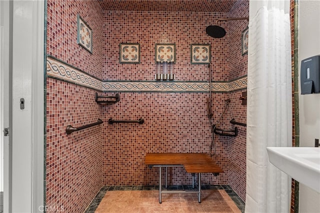 bathroom featuring tile walls, tile patterned floors, and walk in shower