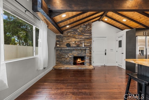 living room with a fireplace, wooden ceiling, lofted ceiling with beams, and dark hardwood / wood-style floors