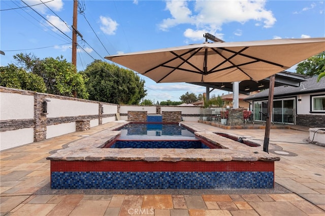 view of patio / terrace featuring a fenced in pool