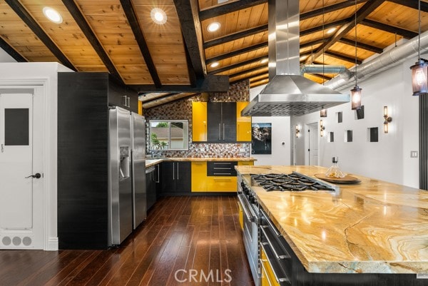 kitchen featuring vaulted ceiling with beams, a center island, stainless steel appliances, and wooden ceiling