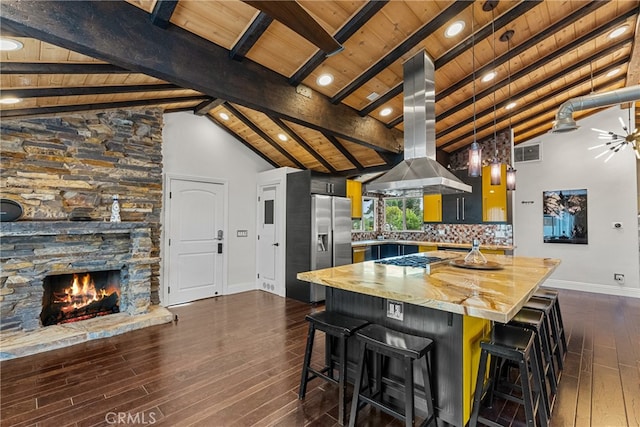 kitchen with wood ceiling, a breakfast bar area, appliances with stainless steel finishes, island range hood, and dark wood-type flooring