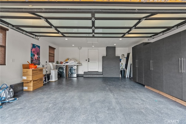 garage featuring washing machine and dryer