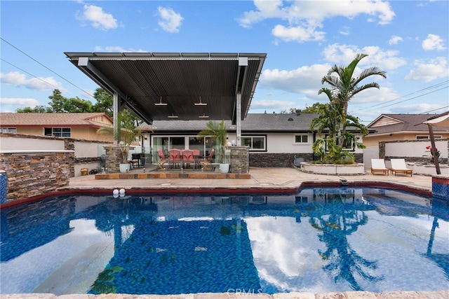 view of swimming pool with a patio area