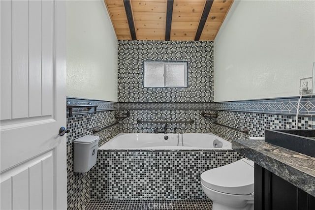 bathroom featuring a bathing tub, wooden ceiling, toilet, vanity, and lofted ceiling with beams