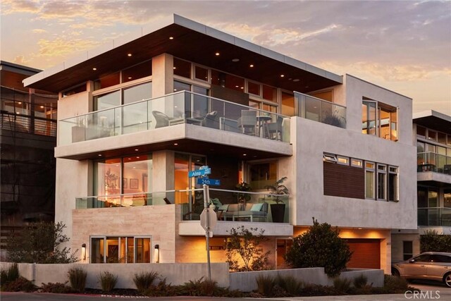 view of outdoor building at dusk