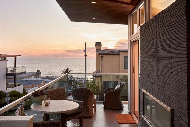 balcony at dusk with a water view