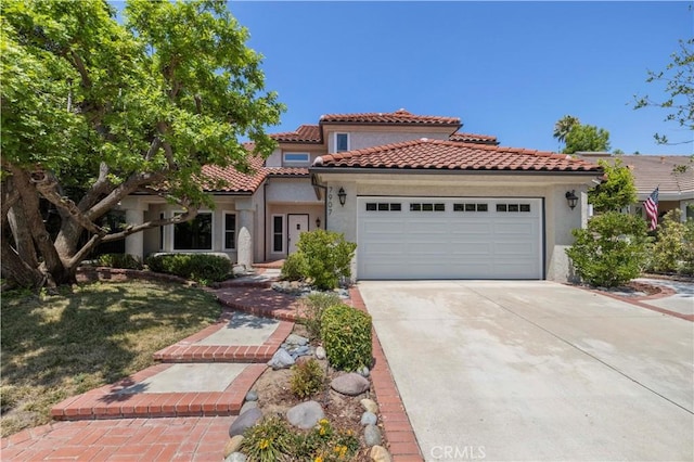 mediterranean / spanish-style home featuring a garage