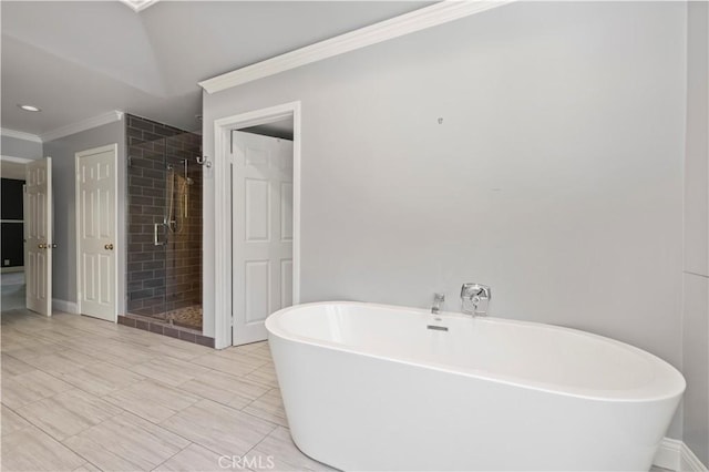 bathroom with ornamental molding and plus walk in shower