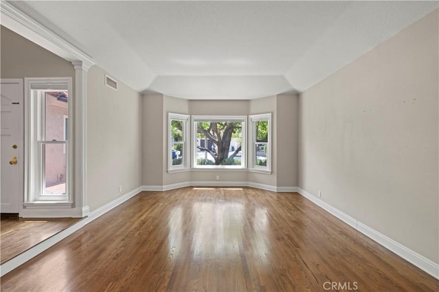 unfurnished room featuring hardwood / wood-style floors