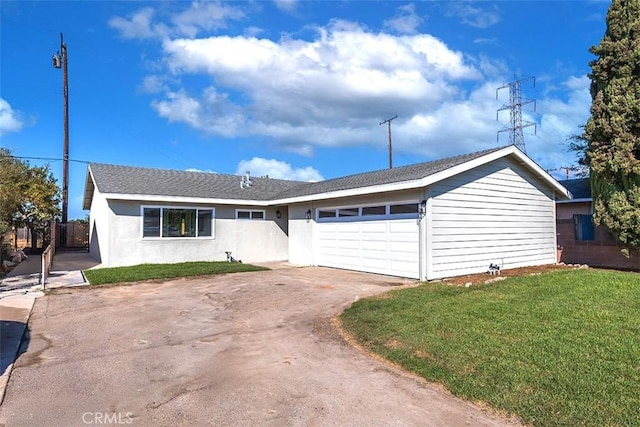 single story home featuring a front yard and a garage