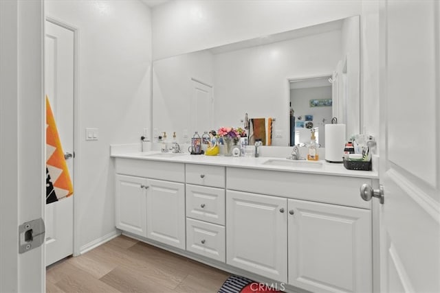 bathroom featuring vanity and wood-type flooring