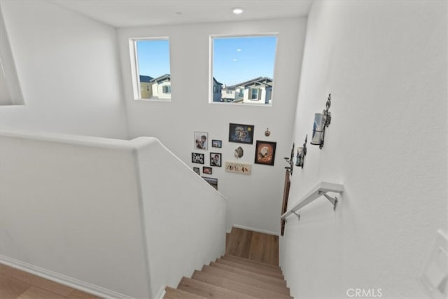 stairs featuring wood-type flooring