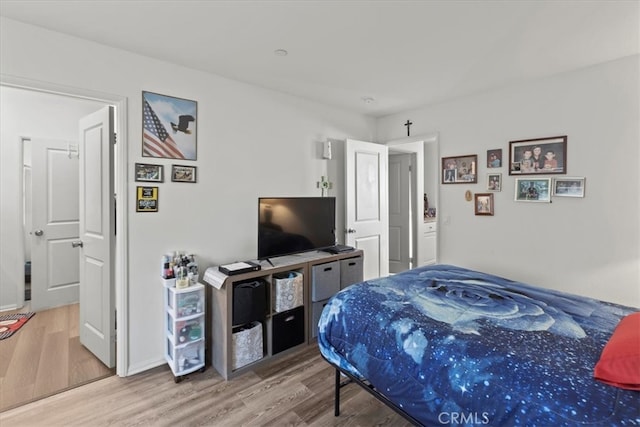 bedroom featuring hardwood / wood-style flooring