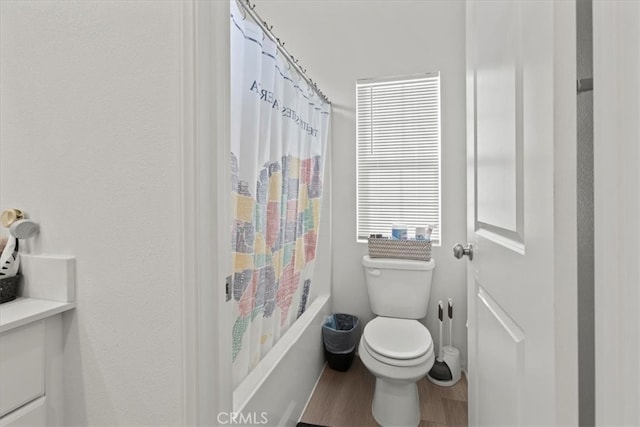 full bathroom featuring shower / bath combination with curtain, toilet, wood-type flooring, and vanity