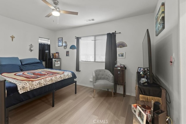 bedroom featuring light hardwood / wood-style flooring and ceiling fan