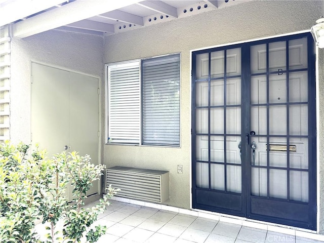 doorway to property featuring french doors