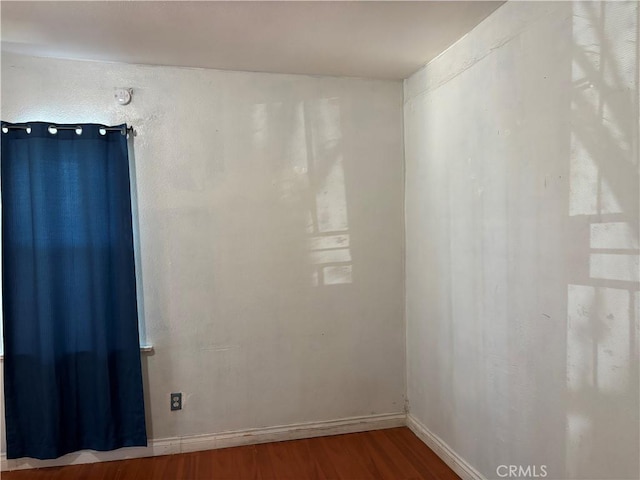 empty room featuring hardwood / wood-style flooring