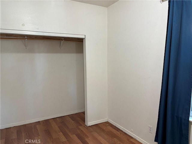 walk in closet featuring dark hardwood / wood-style flooring