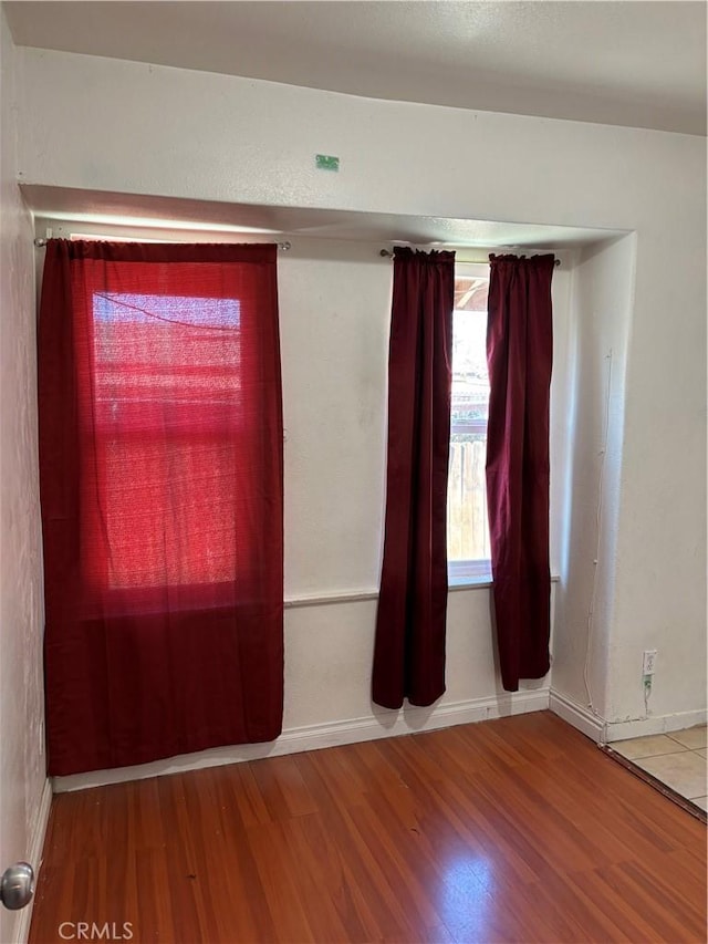 spare room with hardwood / wood-style flooring