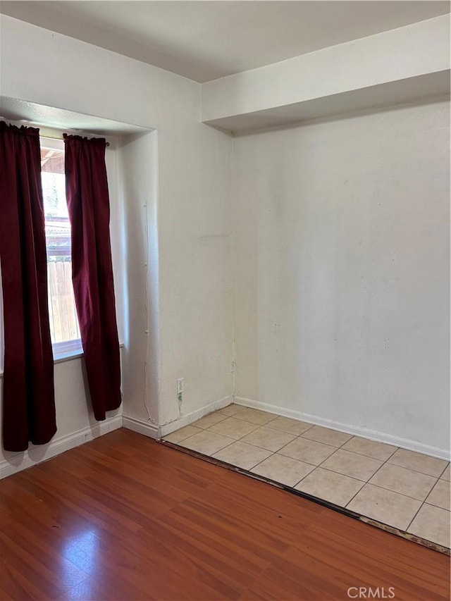 unfurnished room with light hardwood / wood-style flooring